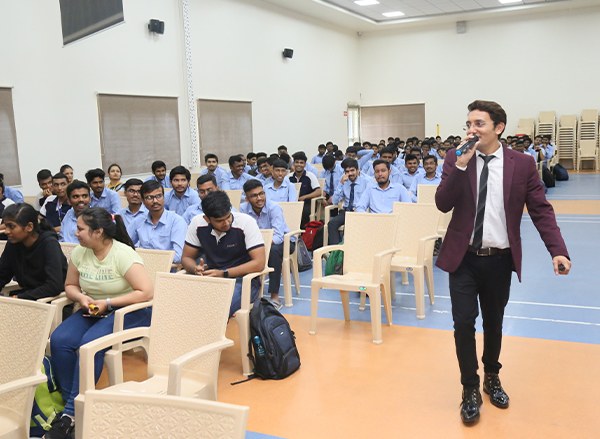 Manish Jain taking a public speaking session for students