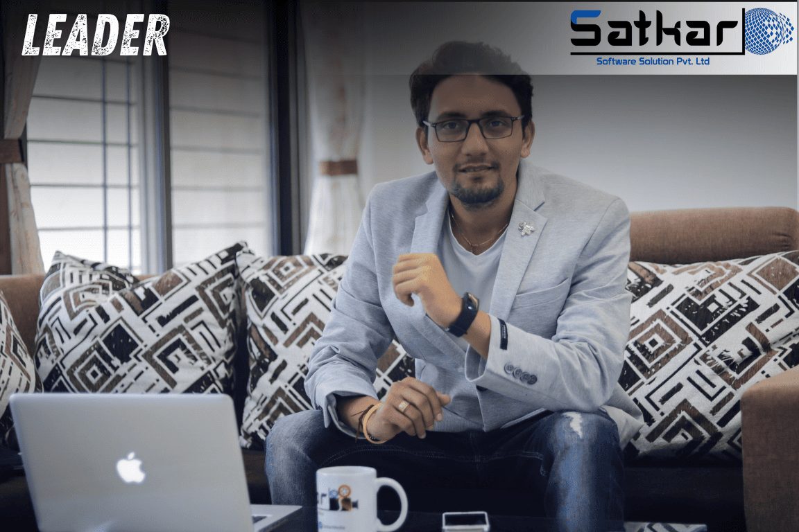 Manish Jain seated with a laptop and coffee