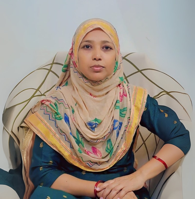 Hamida Magdum, Customer Relationship Executive, seated in an armchair