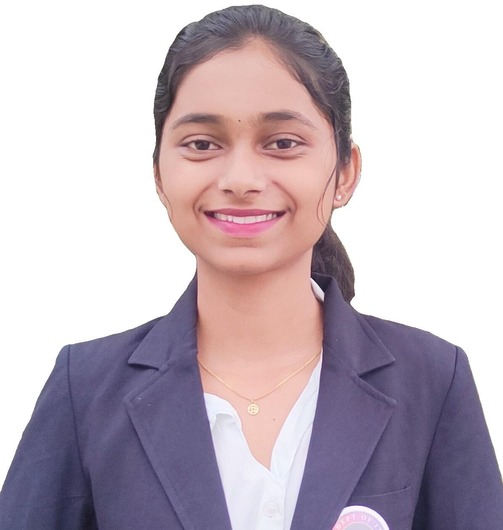 Sakshi Chaugule, Web Developer, smiling in a grey blazer